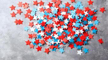 Colorful Star Shapes in Red, White, and Blue on Concrete Background photo