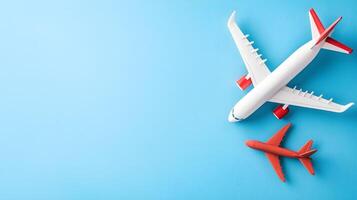 Colorful Airplane Models on Blue Background for Travel Concept photo