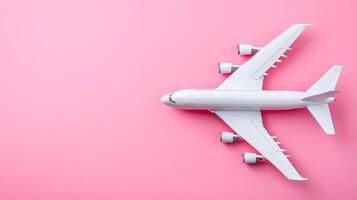 White Airplane Model on Pink Background Minimalist Flat Lay photo