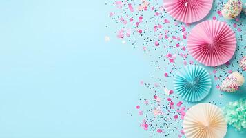 Colorful Paper Decorations and Confetti on Light Blue Background photo
