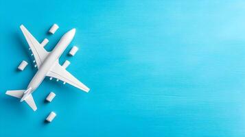 White Airplane Model on Bright Blue Background for Travel Concept photo