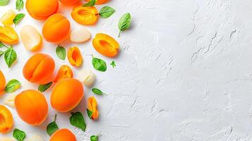 Fresh Apricots and Green Leaves on White Background for Culinary Use photo