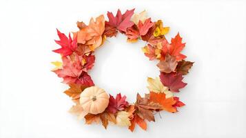 Autumn Wreath with Colorful Leaves and Pumpkin Decoration photo