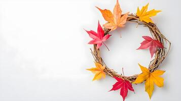 Autumn Wreath with Colorful Maple Leaves on a White Background photo
