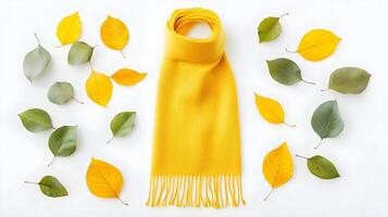Bright Yellow Scarf Surrounded by Colorful Autumn Leaves Arrangement photo