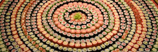 Mandala-style sushi rolls arranged in concentric circles photo