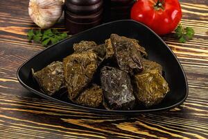 Stuffed dolma - meat in grape leaves photo