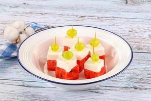 Watermelon with feta and grape photo