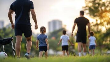 Father and Child Walking Together in a Park During Sunset photo