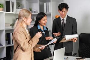 Diverse Business Team Collaborating on Project Strategies in Modern Office Environment photo
