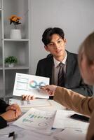 Business Team Collaborates on Data Analysis with Graphs and Charts in Modern Office Setting photo