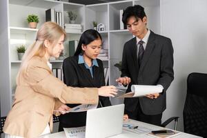 Business Team Collaborating on Data Analysis with Graphs in a Modern Office Setting photo