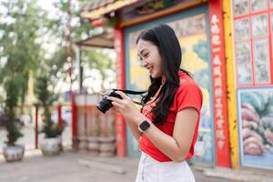 Capturing the spirit of chinese new year a photographer's joyful moment in a colorful cultural setting with camera photo