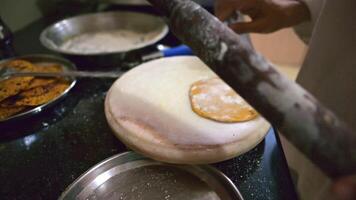 Lady cooking Flat Bread on a Stove Top video