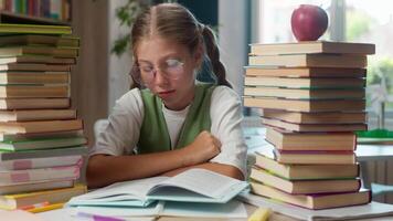 Upset unhappy sad Caucasian depressed teen little girl child kid schoolgirl school student pupil learner in glasses reading book fail test concentration problems hard task homework overload in library video