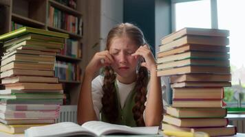 Suffering teenager upset Caucasian little girl shocked kid child looking at two large piles books student pupil learner stressed by education overload homework exhausted overworked indoors classroom video