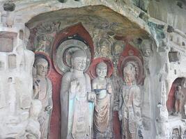 Buddha statues found inside caves by the side of the mountain sides photo