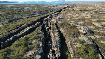 Icelandic Plate Fault. A large canyon with a mountain in the background video