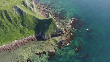 Drone view of a natural stone arch by the sea video
