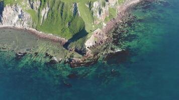 Drone view of a natural stone arch by the sea video