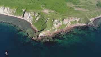 Drone view of a natural stone arch by the sea video