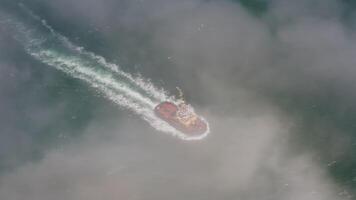 Drone view of the a tugboat in motion video