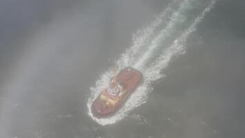 Drone view of the a tugboat in motion video