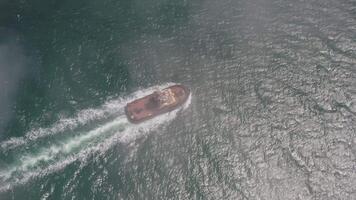 Drone view of the a tugboat in motion video