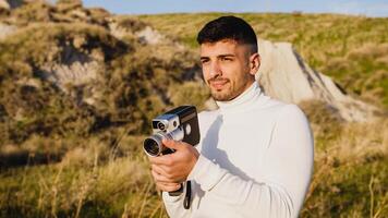 Man Using A Vintage Camera In The Nature photo