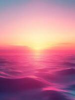 Vibrant pink and purple sunset illuminating calm ocean waves photo
