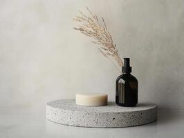 Soap bar and dispenser on stone podium with dried flowers decoration photo
