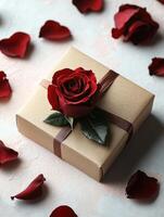 Romantic gift box decorated with fresh red rose and petals photo
