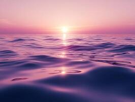 Vibrant purple sunrise reflecting on calm lake with gentle ripples photo