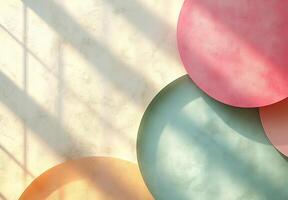 Pastel colored circles on textured background with window light beams photo