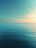 Calm ocean reflecting during twilight photo