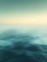 Vibrant sunset illuminating calm ocean waters photo