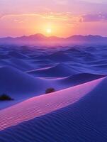 Sand dunes basking in the warm glow of a sunset photo