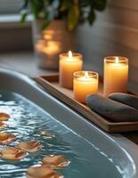 Relaxing pink rose petal bath with burning candles creating a romantic atmosphere photo