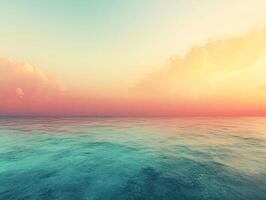 Vibrant pink sunset illuminating calm ocean waters with colorful sky photo