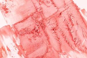 A chic example of a dry blush in a pink tone. chaotic strokes of blush. cosmetic texture. Abstract cosmetic background of decorative cosmetics. photo