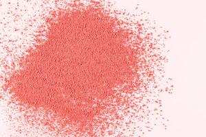 A loose sample of decorative pink blush on a white background. Dry blush texture. layout to advertise texture of the product. A copy space. top view. photo