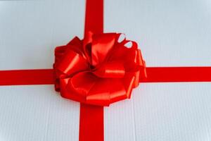 A Circuit component wrapped in white with a red bow photo