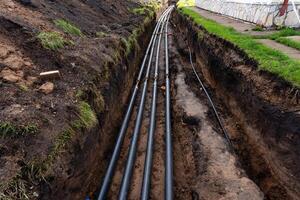 The Underground Installation of PVC Pipes within a trench is essential for various infrastructure projects photo