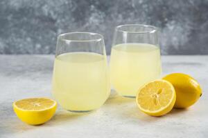 Two cups of fresh lemonade with lemon slices photo