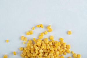 Top view. marinated corn seeds on white background photo
