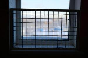 A Grid Style Window Showcasing a Beautiful and Tranquil Snowy View of the Outside World photo