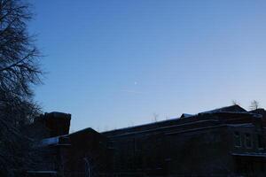 Twilight Serenity Over a Beautiful, SnowCapped Building Surrounded by Calmness and Beauty photo