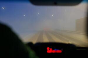 Driving Through a Challenging Snowstorm Blurred Vision, Harsh Conditions, and Increased Risks photo