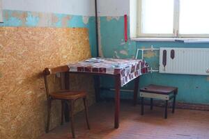 A Simple Room Decorated with a Table and Chairs in a Beautiful Vintage Style Setting photo