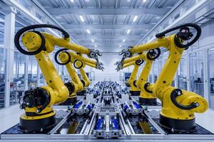 Factory with yellow robotic arms, highlighting automation and advanced technology photo